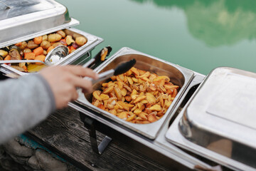 Delicious food in a silver tray at a buffet