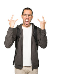 Naughty student making a rock gesture