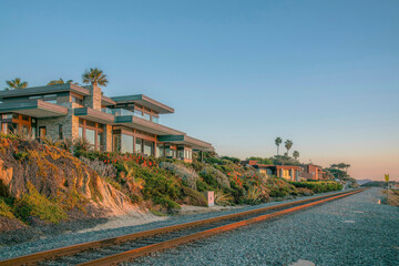 Houses at Del Mar Southern California along railroad on the beach at sunset