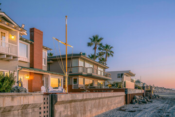 Two-storey houses along the beach at Del Mar Southern California at sunset