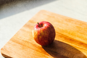 Close up shot of an apple and water droplets in it. Concept