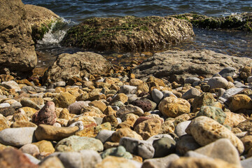 Fototapeta na wymiar a stone shore by the sea