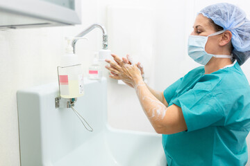 doctor or nurse cleans hands effectively before surgery, 