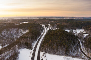 Beautiful aerial view of snow covered pine forests. Rime ice and hoar frost covering trees. Scenic landscape near Vilnius, Lithuania.