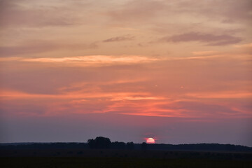 The play of colors in the sky at the time of the summer sunset