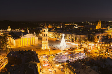 Beautiful aerial view of decorated and illuminated Christmas tree on the Cathedral Square at night in Vilnius, Lithuania.