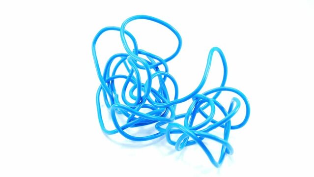 Blue wire cable of usb and adapter isolated on white background.Electronic Connector.Slow motion footage moving from right to left.Macro vdo.Selection focus.