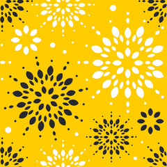 Snowflakes are white and black on a yellow background. Seamless cute winter pattern. 