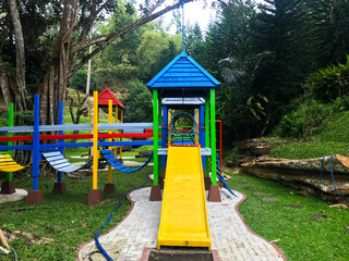 Modern Playground Equipment. Modern Colorful kids playground on yard in the park. image for background of playground, activities at public park.