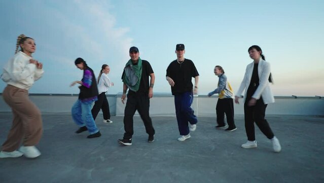 boys are breakdancing in youth hangout, performing power moves and toprock dance, active and energy