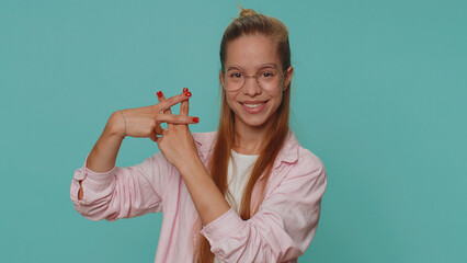Hashtag. Cheerful pretty teenager young girl showing hashtag symbol with hands, likes tagged...