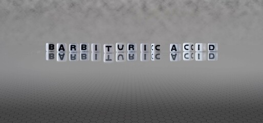 barbituric acid word or concept represented by black and white letter cubes on a grey horizon...