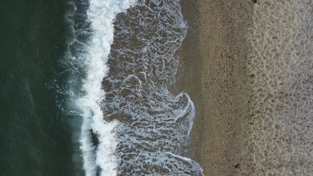Symmetrical aerial view of sea waves of Asprovalta sea in Greece