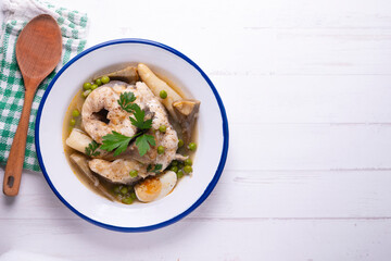 Conger eel with white asparagus and egg. Traditional Spanish tapas from a fishing village.