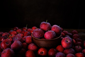 Clay plate with red apples. Background from ripe red apples.