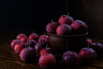 Clay plate with red apples. Red ripe apples.