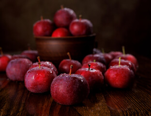 Clay plate with red apples. Red ripe apples.