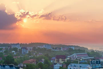 Foto op Canvas The sun rises over the city Truskavets, Ukraine. Summertime. © Serhii Khomiak