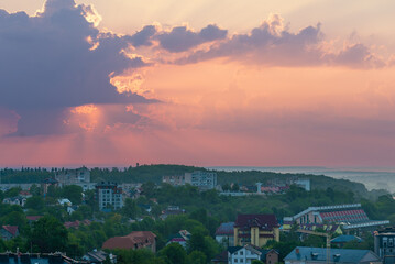 The sun rises over the city Truskavets, Ukraine. Summertime.