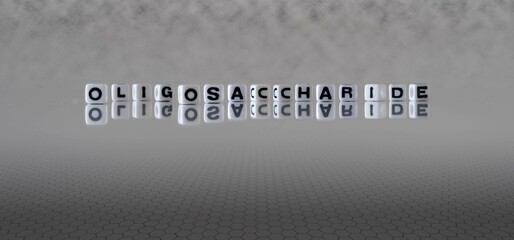 oligosaccharide word or concept represented by black and white letter cubes on a grey horizon...