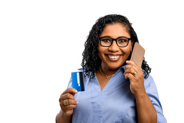 woman holding money talks on cell phone and smiles contentedly, white background