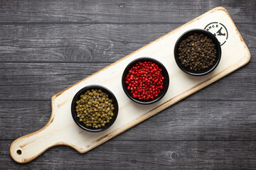 3 bowls with peppers in 3 colors