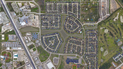 League city, Texas, settlement of the wealthy district with water channels, looking down aerial...