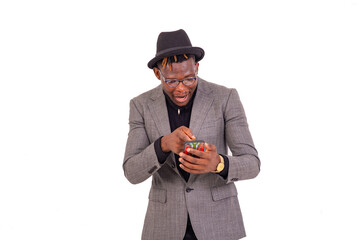 young surprised businessman using a mobile phone smiling.