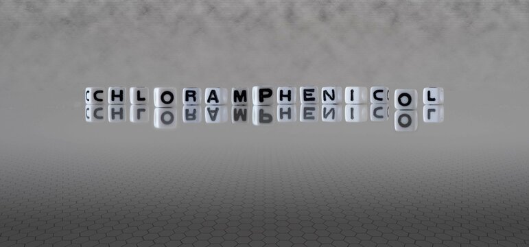chloramphenicol word or concept represented by black and white letter cubes on a grey horizon background stretching to infinity