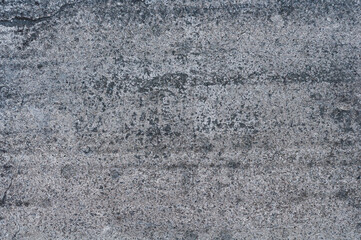 Gray concrete stucco wall, uneven grungy vintage background close-up, grunge texture.