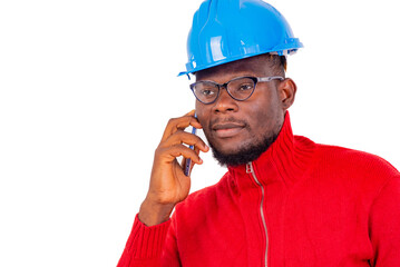 close up of an engineer communicating on cellphone.