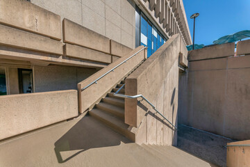 Exterior view of a building with outdoor staircase in sunny Austin Texas