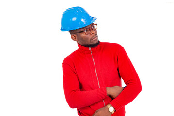 portrait of a young man with safety helmet, pensive.