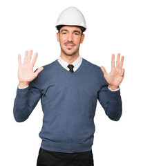 Young architect making a gesture of number nine