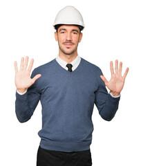 Young architect making a gesture of number ten