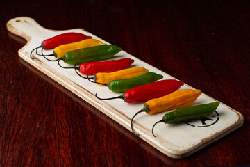 red hot peppers on wooden background
