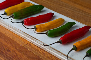 red hot peppers on wooden background