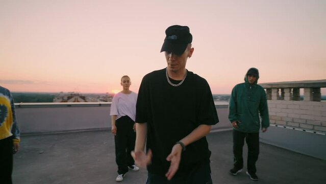 modern hip-hop dance styles for youth, teens hang out together, cool guy is dancing popping style