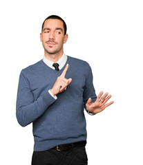 Haughty young man making a contemptuous gesture