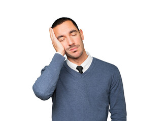 Relaxed young man making a gesture of sleep