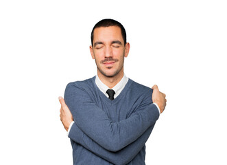Happy young man doing a hug gesture