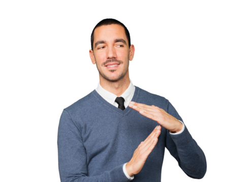 Friendly young man making a time out gesture with his hands
