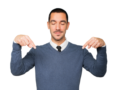 Surprised young man pointing down