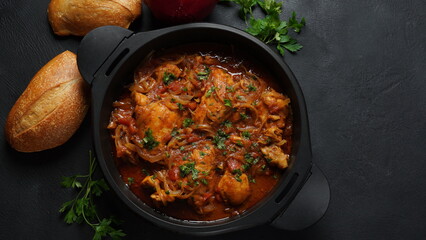 Chakhokhbili - traditional Georgian dish. Chicken stewed with fresh coriander tomatoes and herbs
