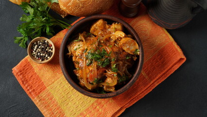 Chakhokhbili - traditional Georgian dish. Chicken stewed with fresh coriander tomatoes and herbs