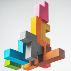 Abstract construction from wooden blocks. The concept of logical thinking..