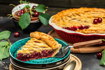 Delicious Homemade Cherry Pie, Flaky Crust, piece on a plate and the whole homemade cherry pie, Long banner format. top view