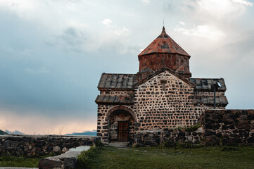 an ancient Christian temple built of stone blocks located in Armenia on the shores of Lake Sevan....