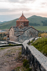 Fototapeta premium An ancient Christian monastery built of stone many centuries ago. Sevanavank monastery in Armenia on Lake Sevan. Concept of world religions and ancient culture