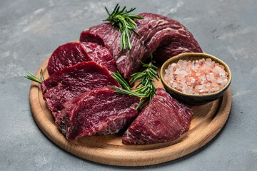 Beef Tenderloin fillet with rosemary and spices. Preparing fresh beef steak ready to cook, Restaurant menu, dieting, cookbook recipe. place for text. top view